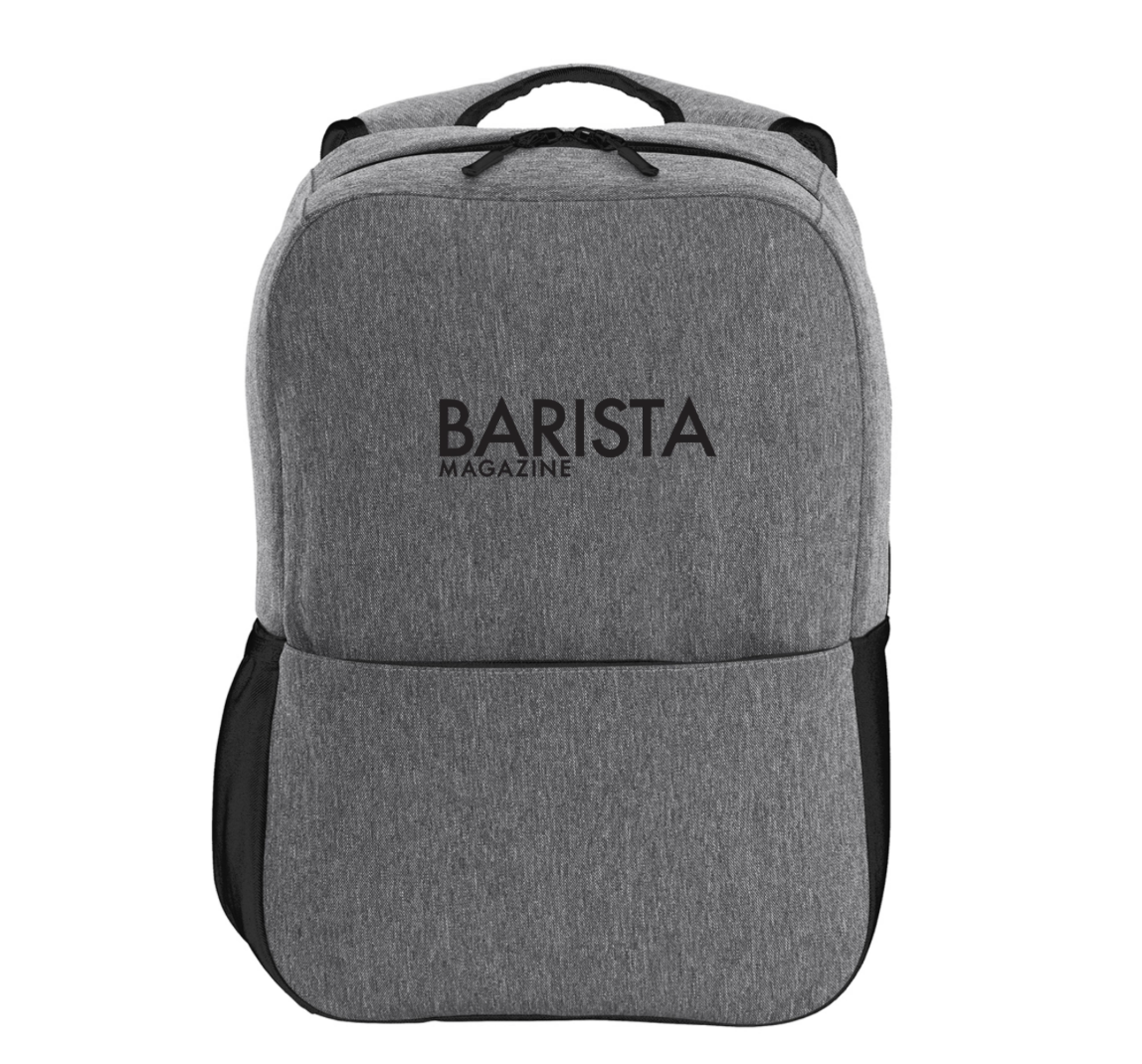 Gray backpack with 'Barista Magazine' logo on a white background