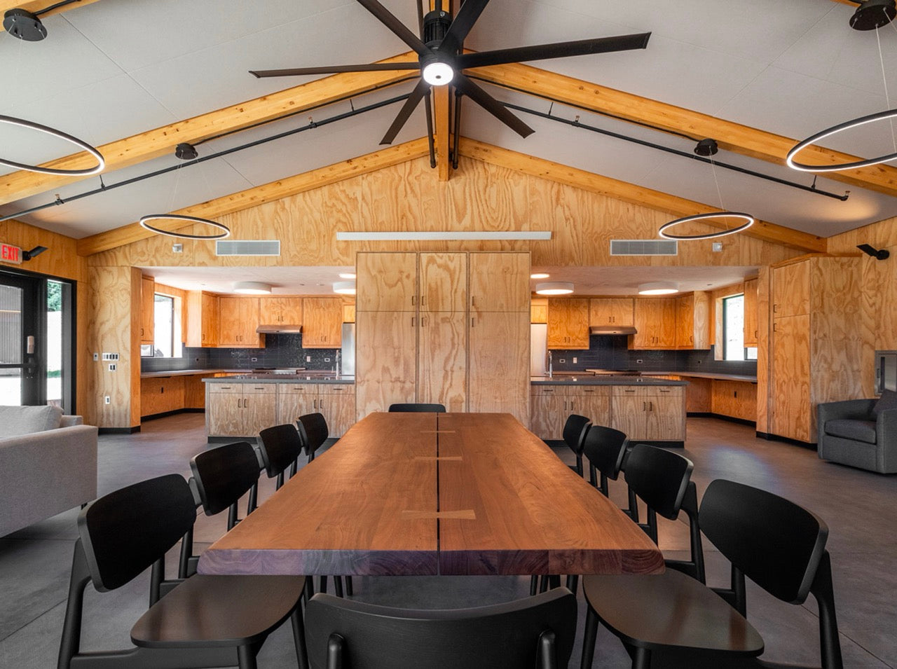 Camp kitchen with wooden dining table and chairs
