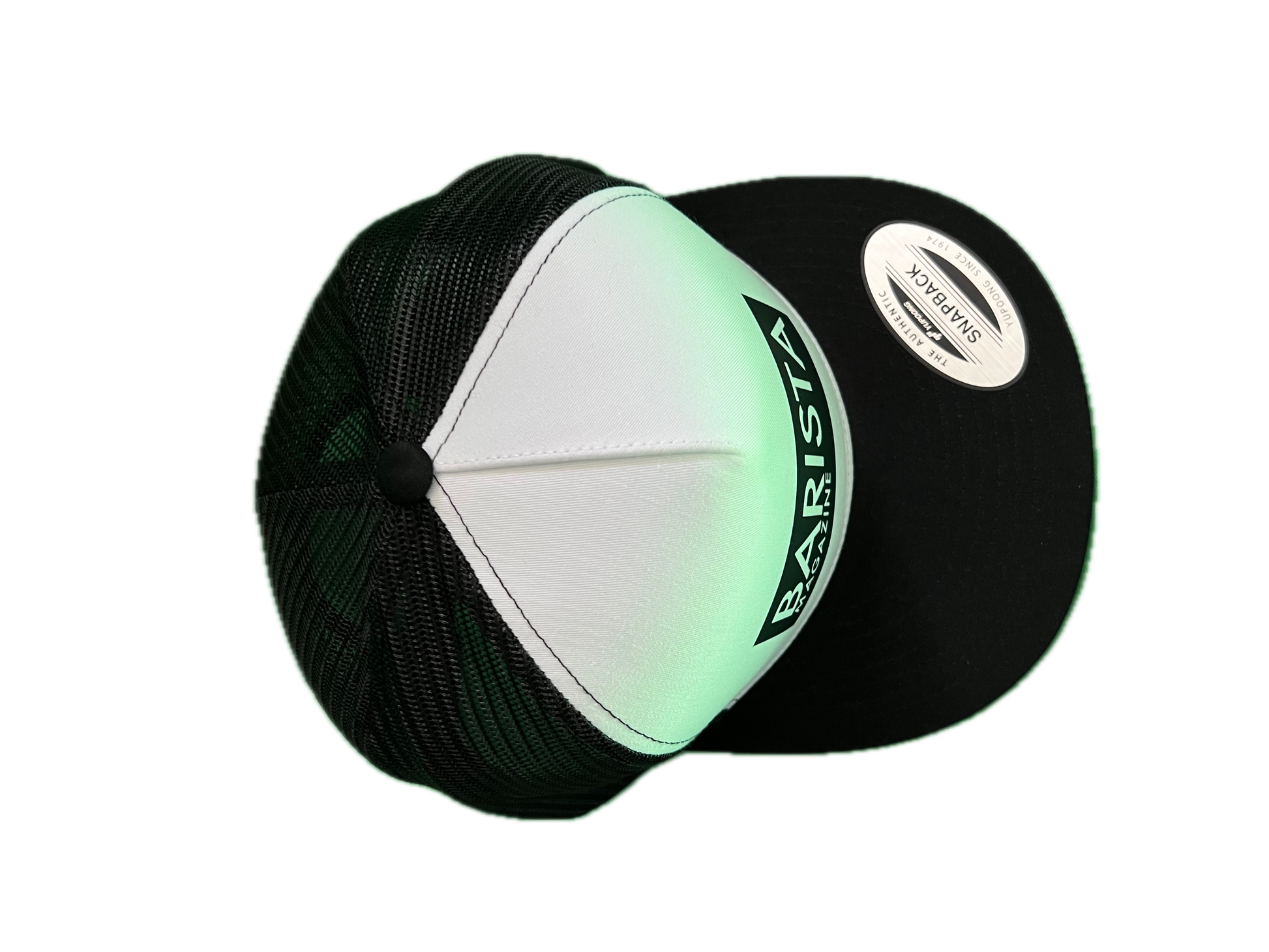 Black and white cap with 'Barista' branding on a white background