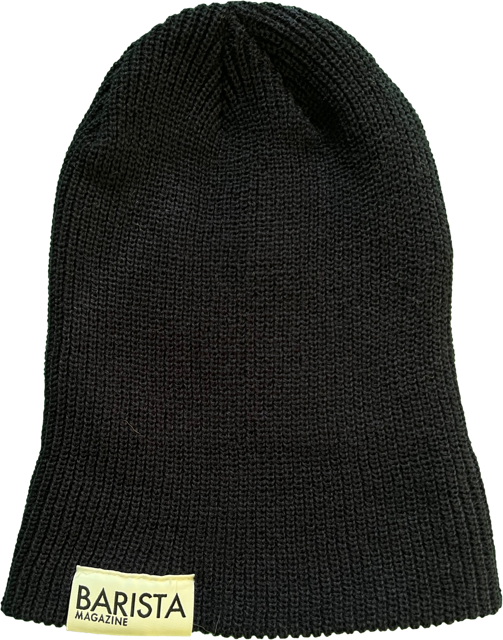 Navy knit beanie with a white 'Barista Magazine' label on a white background