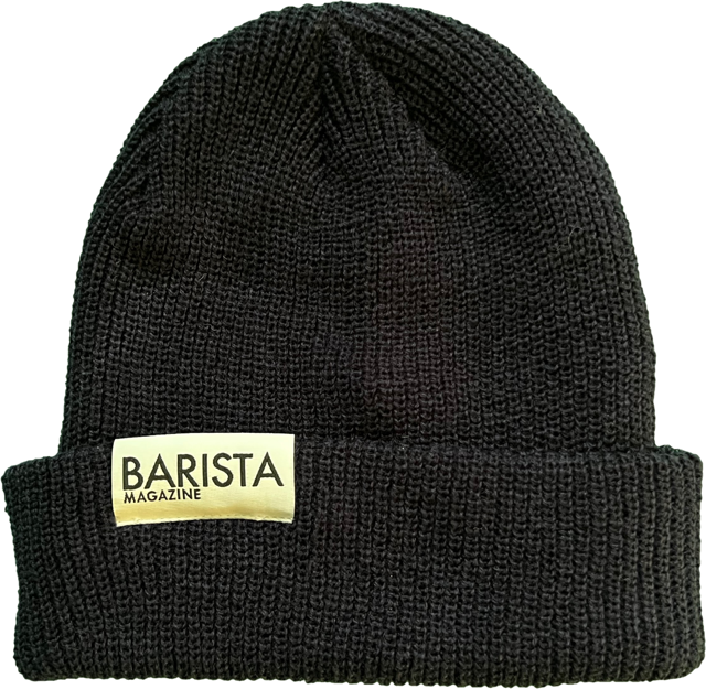 Navy knit beanie with 'Barista Magazine' label on a white background
