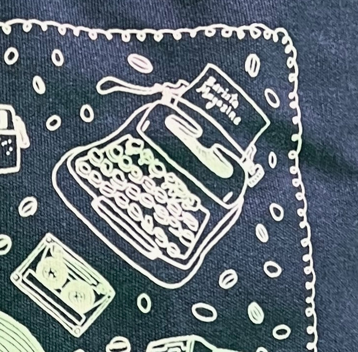 Close up of design on Barista Magazine anniversary tote featuring drawings of physical media.